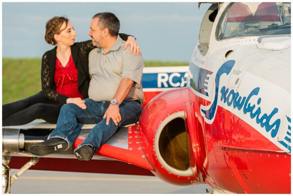 Shawn & Jennifer - 15 Wing Moose Jaw - 05 - Bride & Groom sit on the wing of a Snowbird