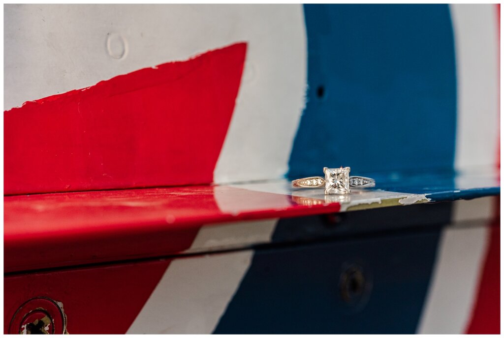 Shawn & Jennifer - 15 Wing Moose Jaw - 06 - Diamond engagement ring sparkles on plane