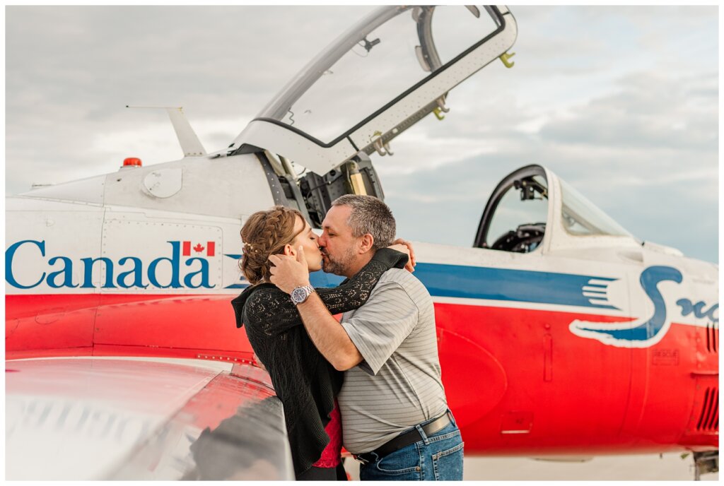 Shawn & Jennifer - 15 Wing Moose Jaw - 07 - Couple share a kiss in front of Snowbird