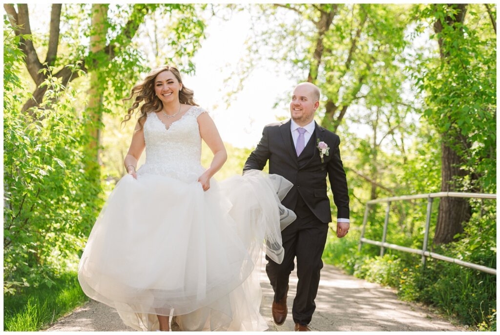 Trevor & Kim Wedding - 28 - Kim and Trevor sharing a joyful frolic in rotary park