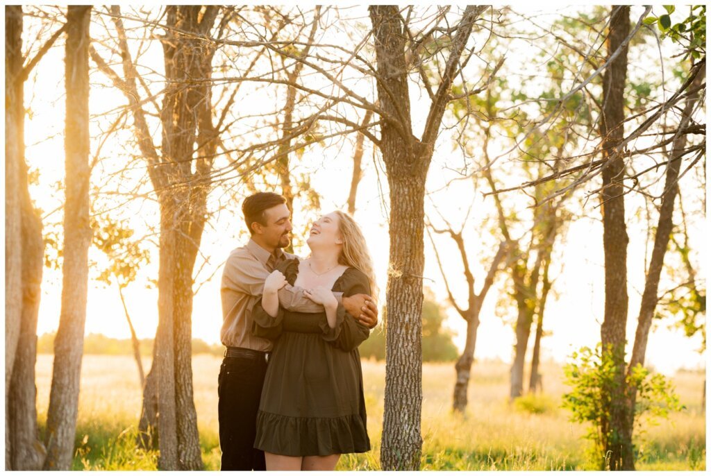 Orrin & Jade - 08 - Weyburn Engagement - Couple laughs in the sunlight