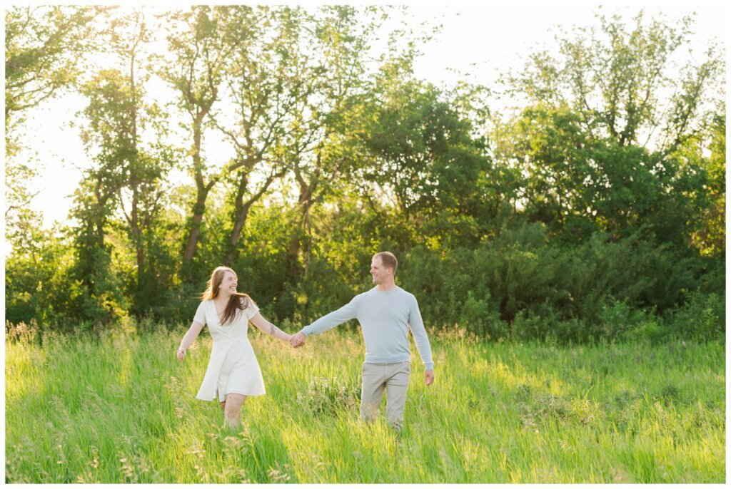 Ryan & Melissa - 01 - Wascana Habitat Conservation Area - Couple walks through tall grass