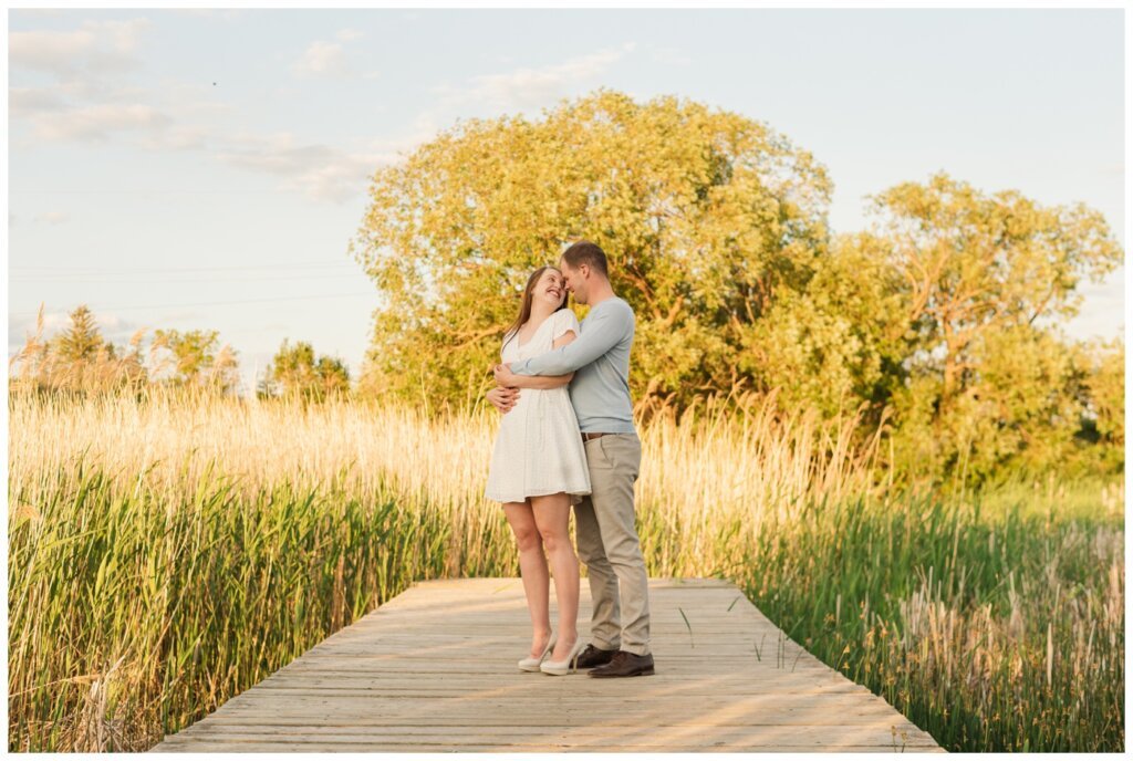 Ryan & Melissa - 08 - Wascana Habitat Conservation Area - Couple stands together on dock