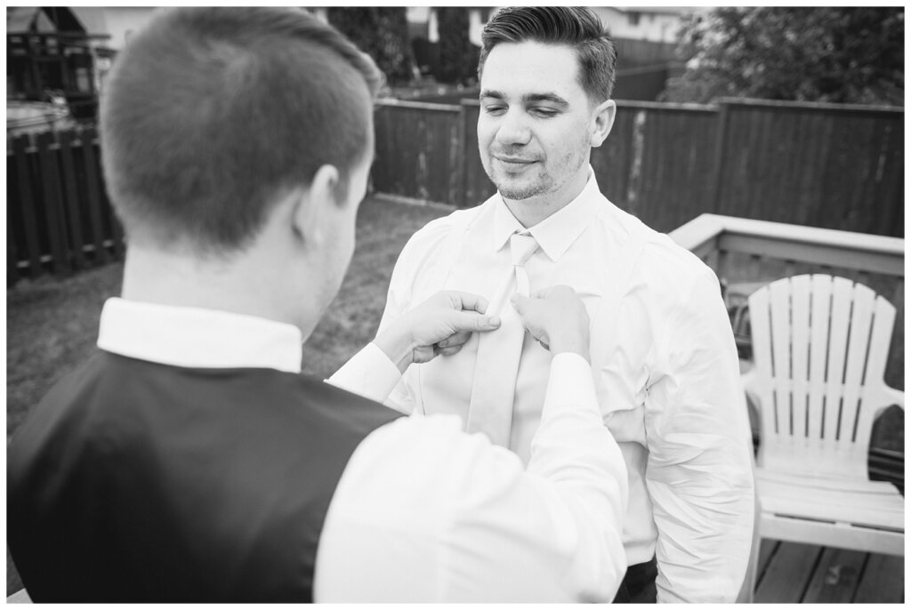 Tris & Jana - Lumsden Wedding - 01 - Groom gets a hand with tie