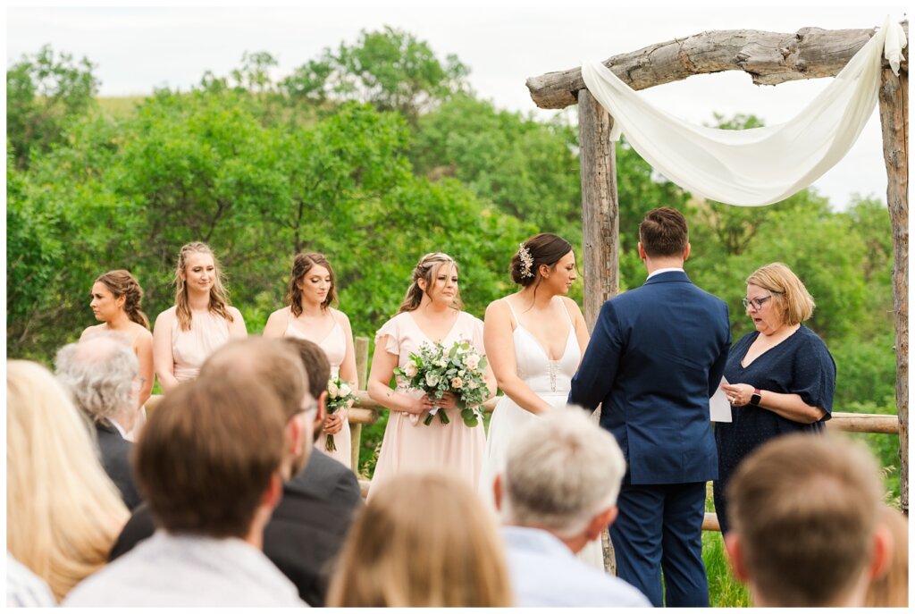 Tris & Jana - Lumsden Wedding - 16 - Bride & Groom standing at the altar