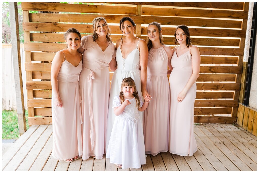 Tris & Jana - Lumsden Wedding - 25 - Bride & bridesmaids pose in their dresses