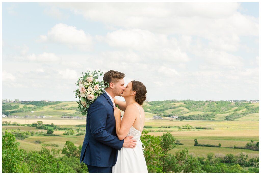 Tris & Jana - Lumsden Wedding - 27 - Bride & Groom share a kiss overlooking the Lumsden Valley