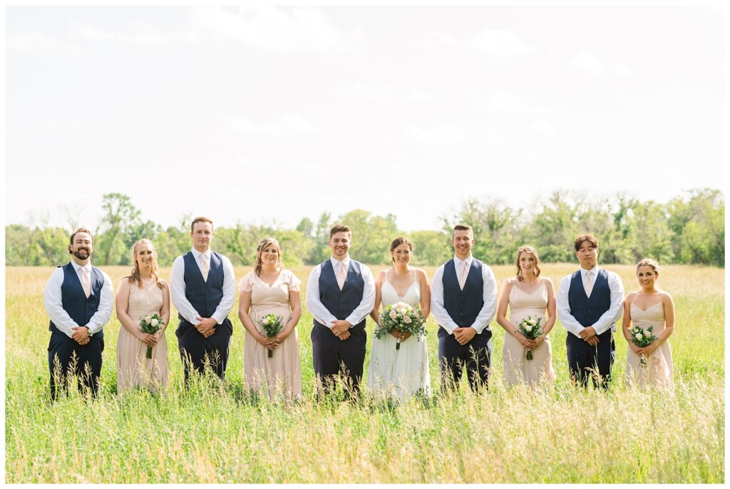 Tris & Jana - Lumsden Wedding - 31 - Bridal party poses in field
