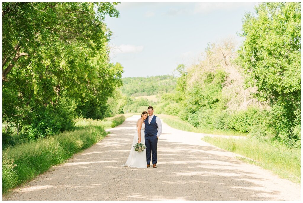 Tris & Jana - Lumsden Wedding - 32 - Bride & Groom pose on Seven Bridges Road