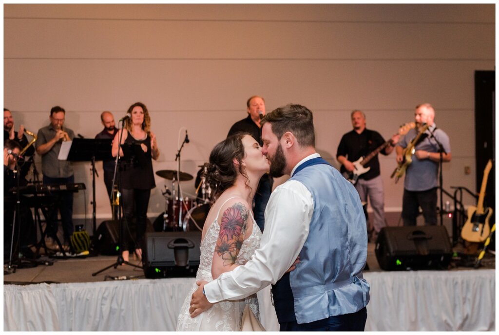 Mitch & Val - 39 - Regina Wedding - Bride & Groom share a kiss on the dance floor