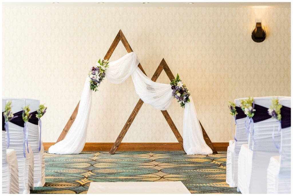 Andrew & Alisha - Regina Wedding Photography - 11 - Wood arch ceremony decor at the Doubletree by Hilton done by Imagine Events