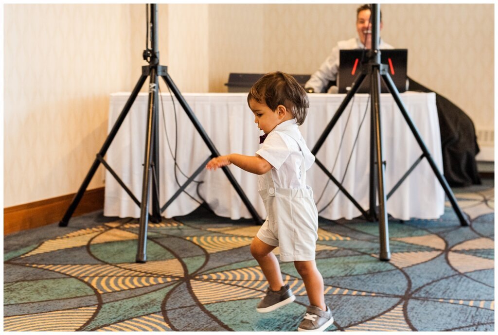 Andrew & Alisha - Regina Wedding Photography - 13 - Ring bearer makes his move for escape