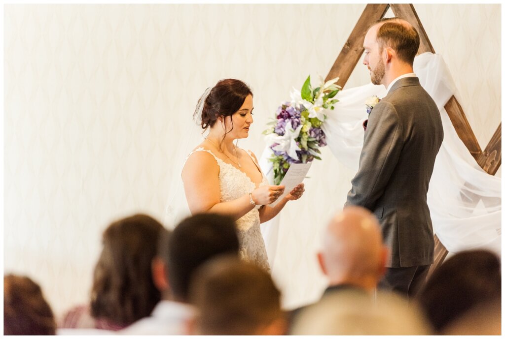 Andrew & Alisha - Regina Wedding Photography - 18 - Bride reads her personal vows to her groom