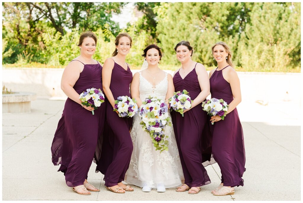 Andrew & Alisha - Regina Wedding Photography - 23 - Bride with her bridesmaids in purple dresses from Newline Fashions & Bridal