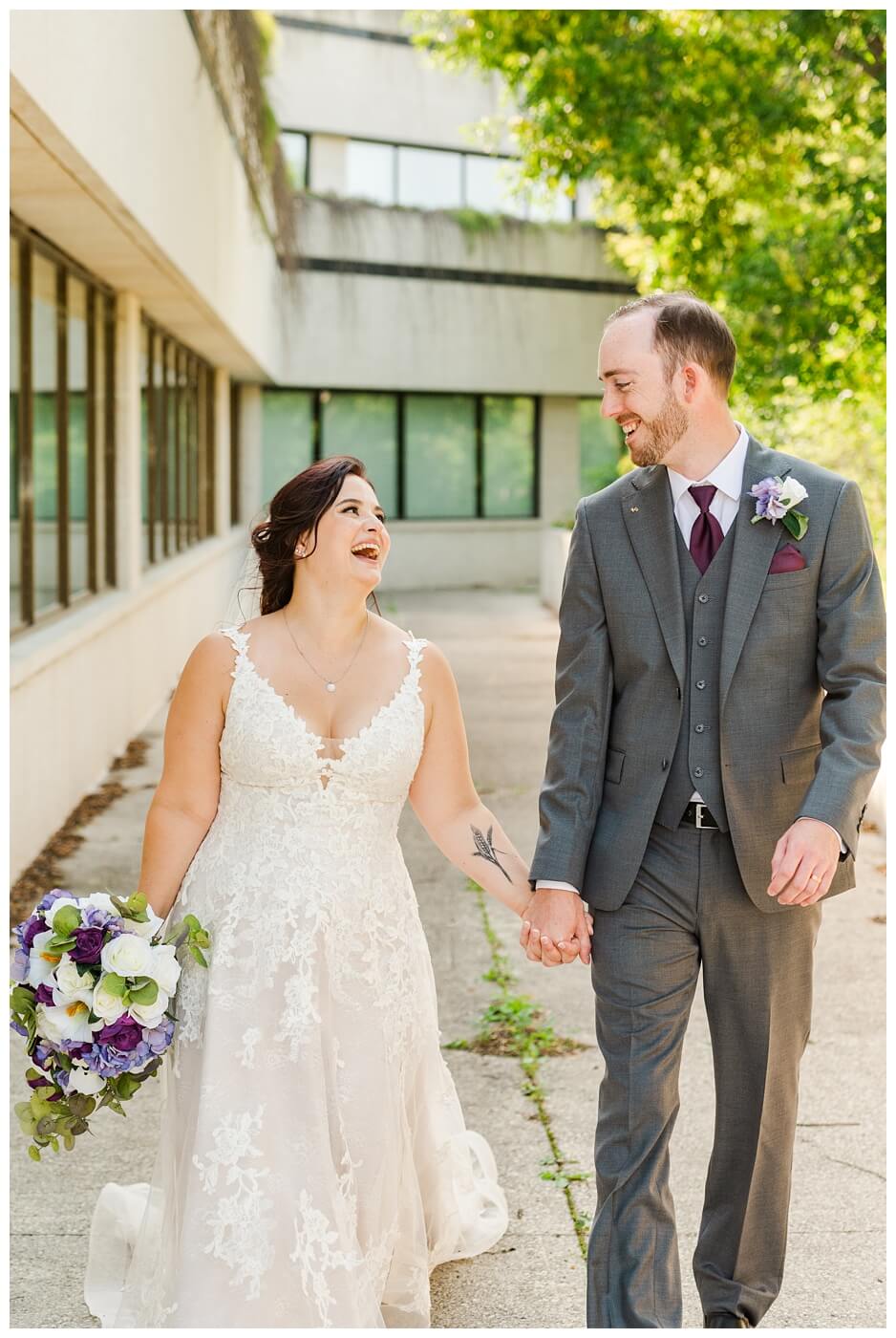 Andrew & Alisha - Regina Wedding Photography - 29 - Bride & Groom laugh as they walk holding hands