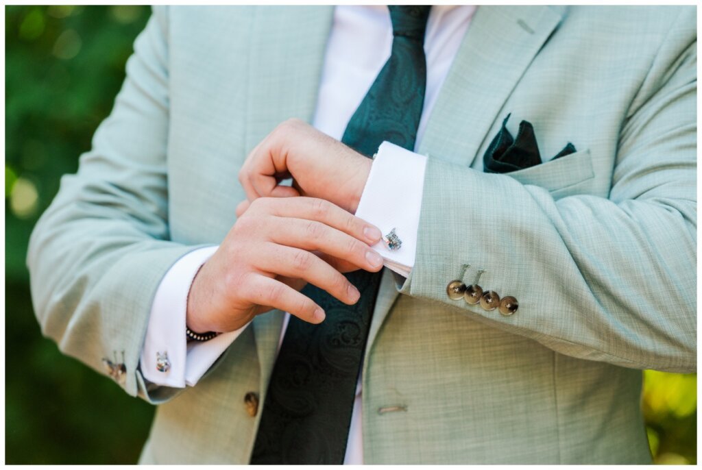 Declan & Katherine - 05 - Regina Wedding - Groom wears Paul Smith cufflinks with Scottish Terrier