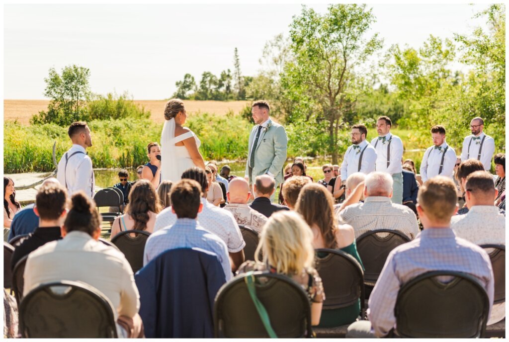 Declan & Katherine - 35 - Regina Wedding - Bride & groom stand in middle of circle for their ceremony