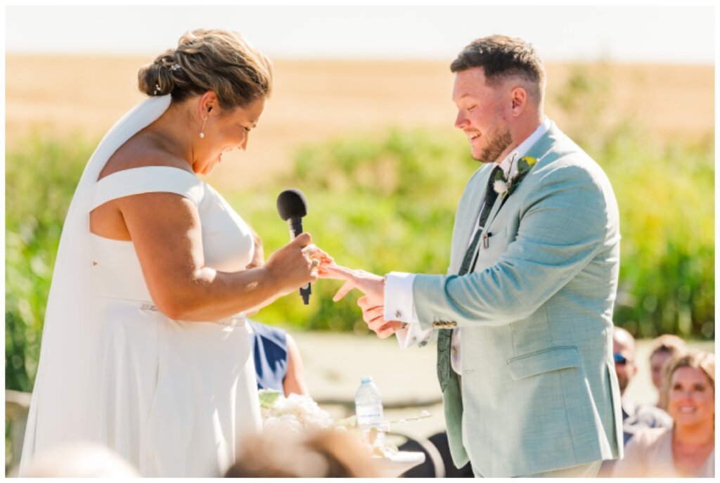 Declan & Katherine - 38 - Regina Wedding - Bride & groom exchange rings