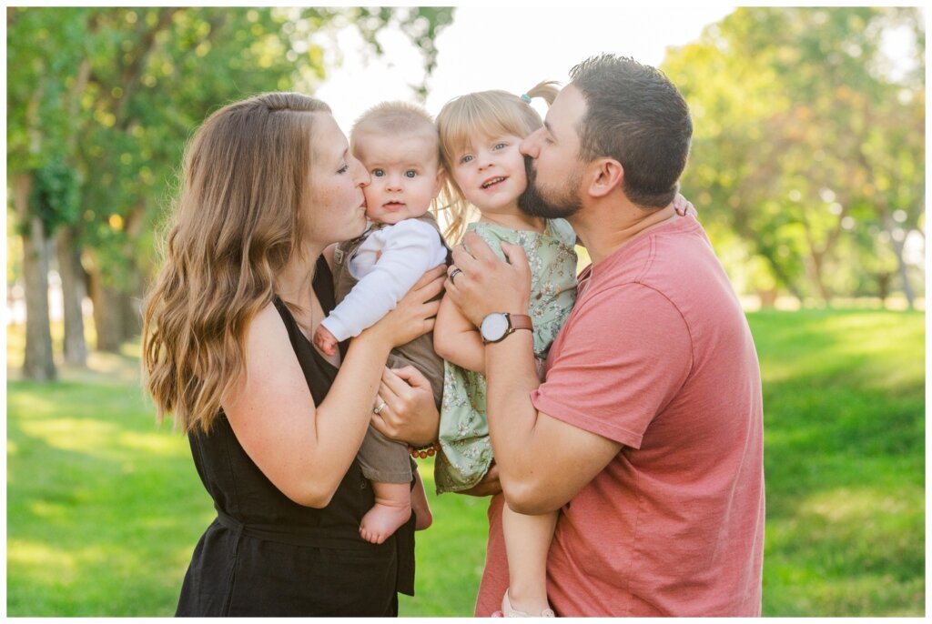 Eyre Family - 01 - Regina Family Kissing kids on the cheeks