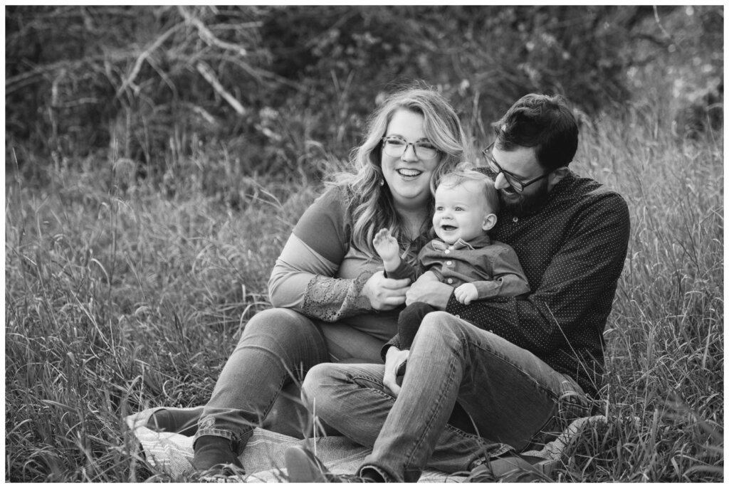 Moffatt Family - 05 - Regina Family Session - Family sitting on blanket in tall grass