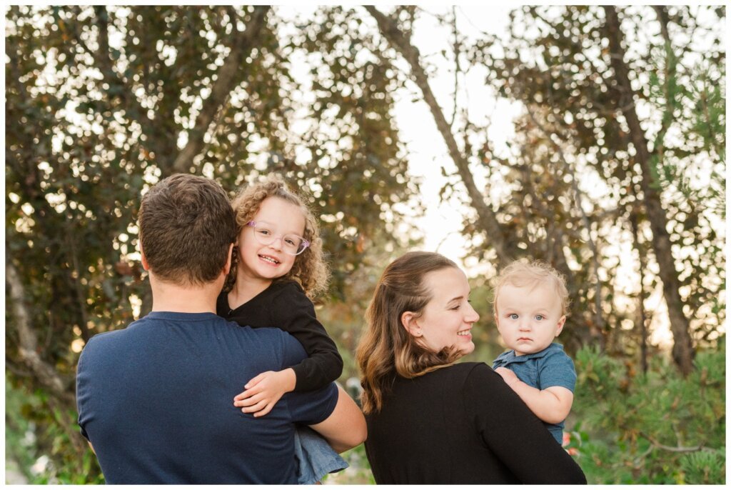 Swereda Family - 10 - Regina Family - Kids smile over mom and dads shoulders