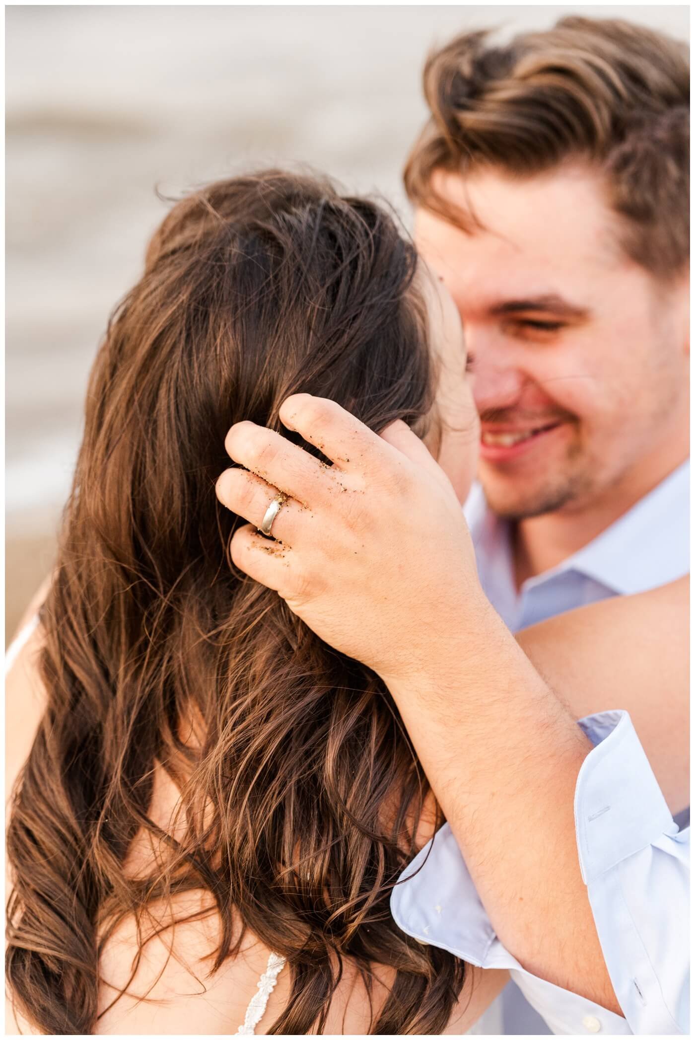 Tris & Jana - 12 - Regina Encore Session - Groom runs his sandy fingers through the brides hair