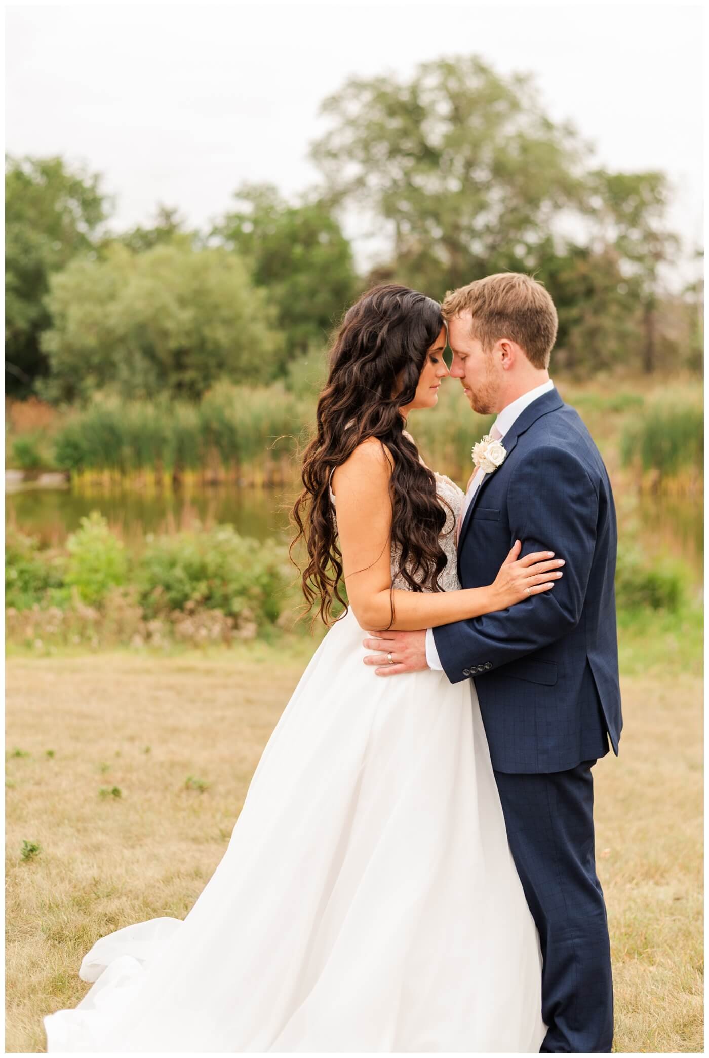 Adam & Caitlin - 26 - Regina Wedding - Bride & Groom pause for a quiet moment