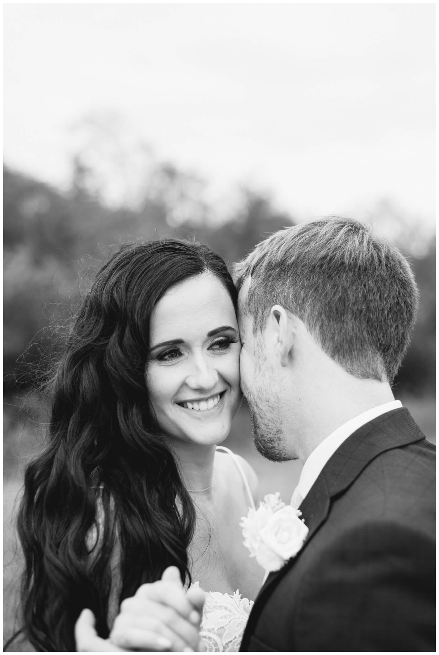 Adam & Caitlin - 28 - Regina Wedding - Groom whispers in his Brides ear