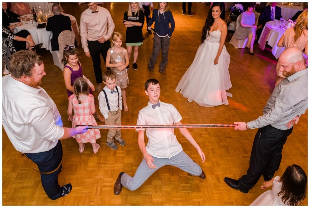 Adam & Caitlin - 39 - Regina Wedding - LED limbo stick