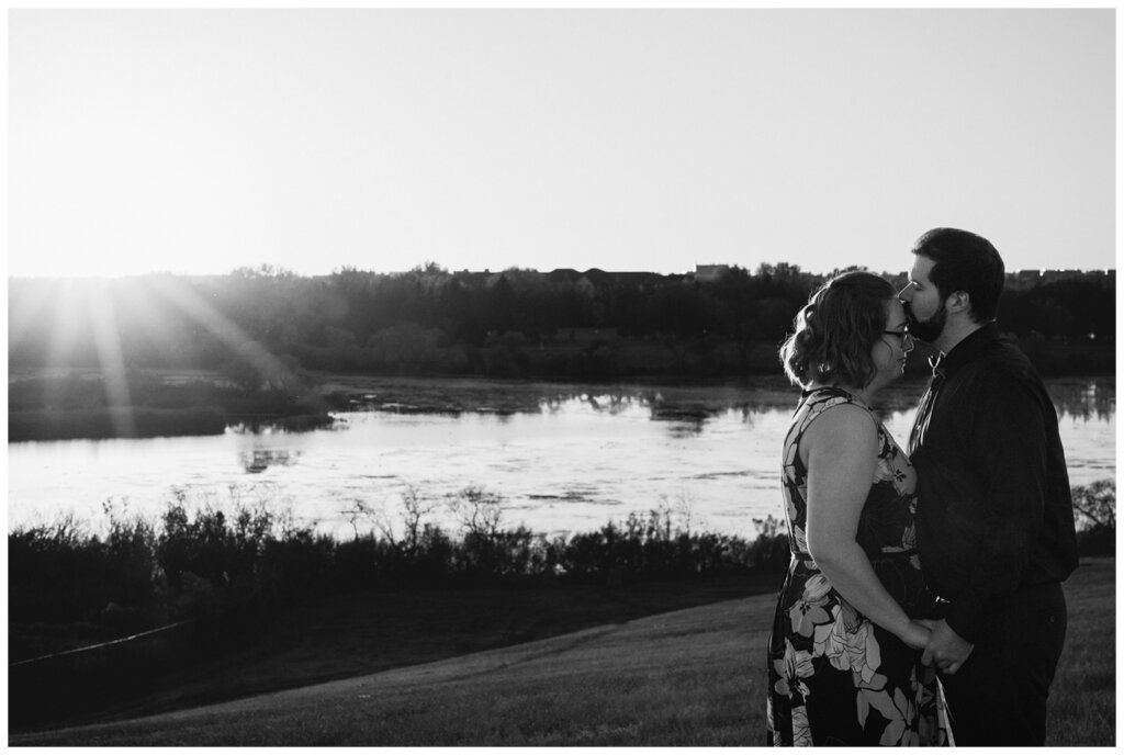 Jared & Haley - Engagement Session - 08 - Black and white of Jared kissing Haley's head at Douglas Park Hill