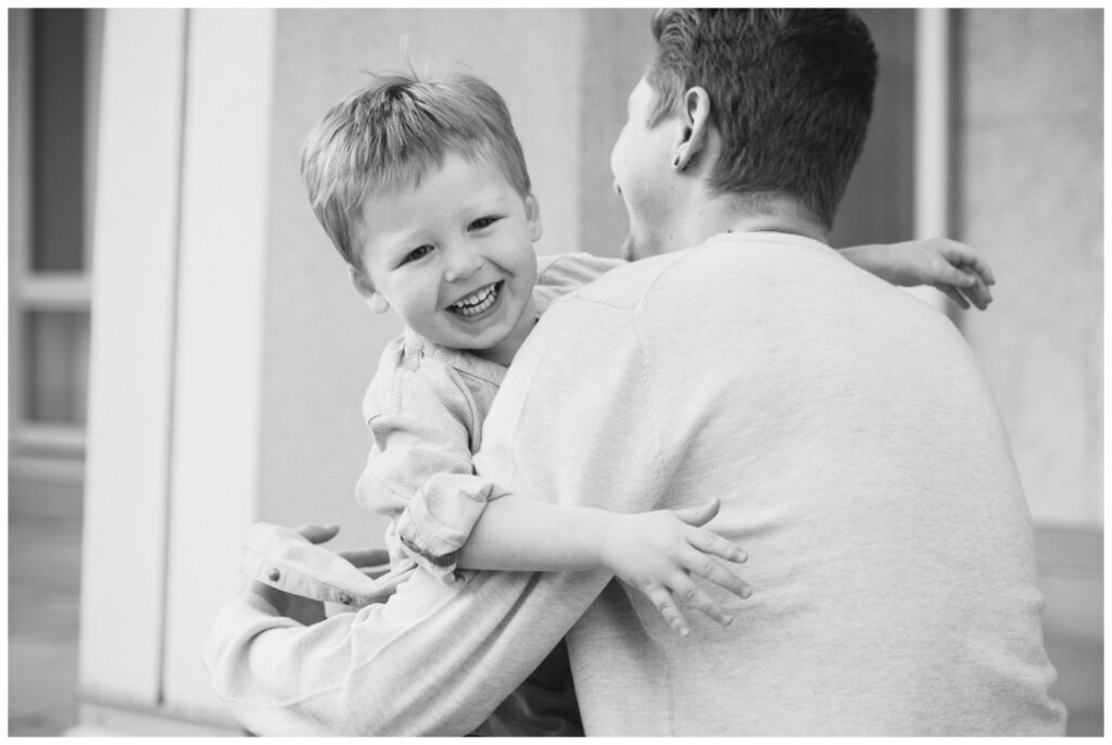 McFie Family - 02 - Regina Family Session Little boy runs to give dad a hug