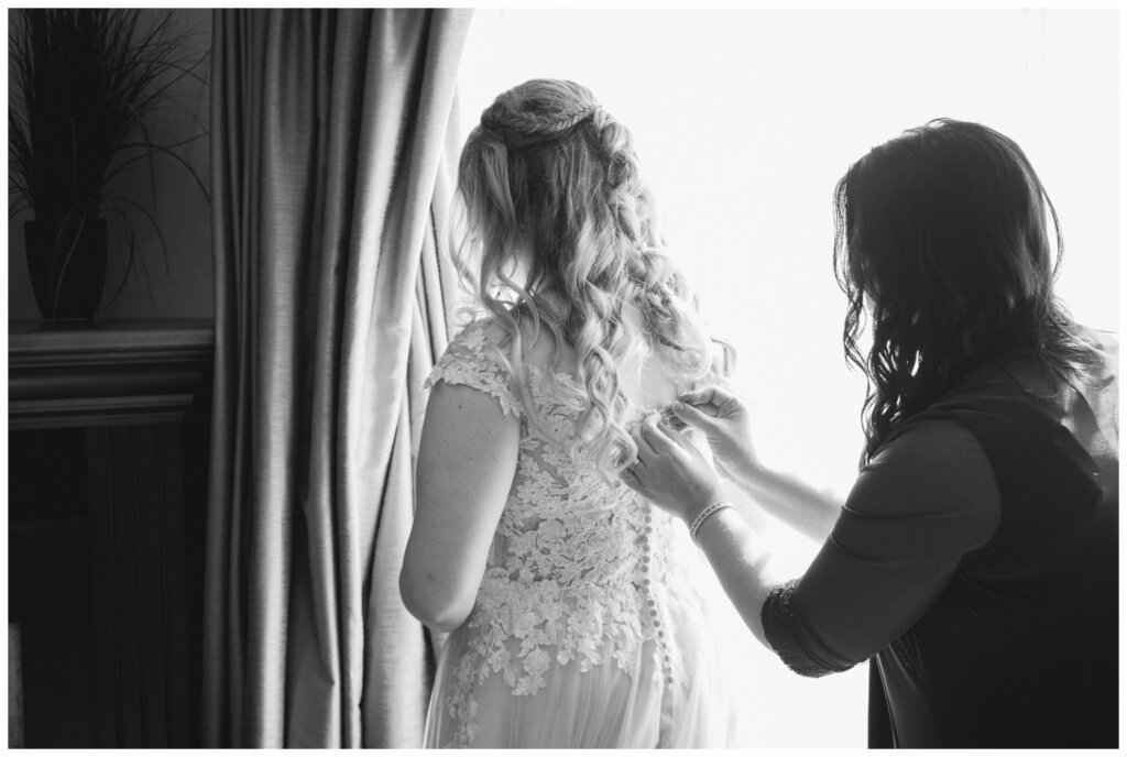 Orrin & Jade - 08- Weyburn Wedding - Brides mother helps her do up her buttons