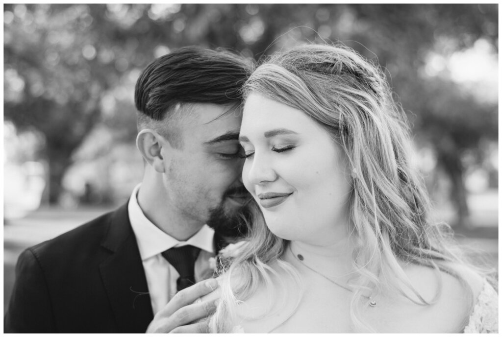 Orrin & Jade - 19 - Weyburn Wedding - Groom whispers to his bride