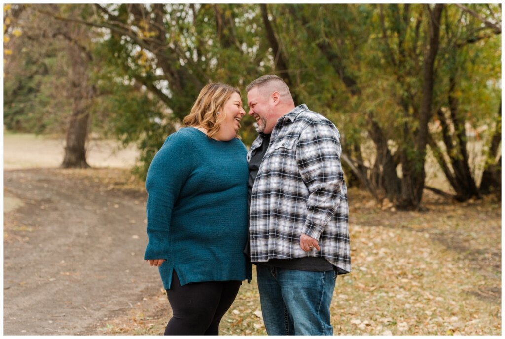 Scott & Ashley - 03 - Husband & wife laugh together in Douglas Park