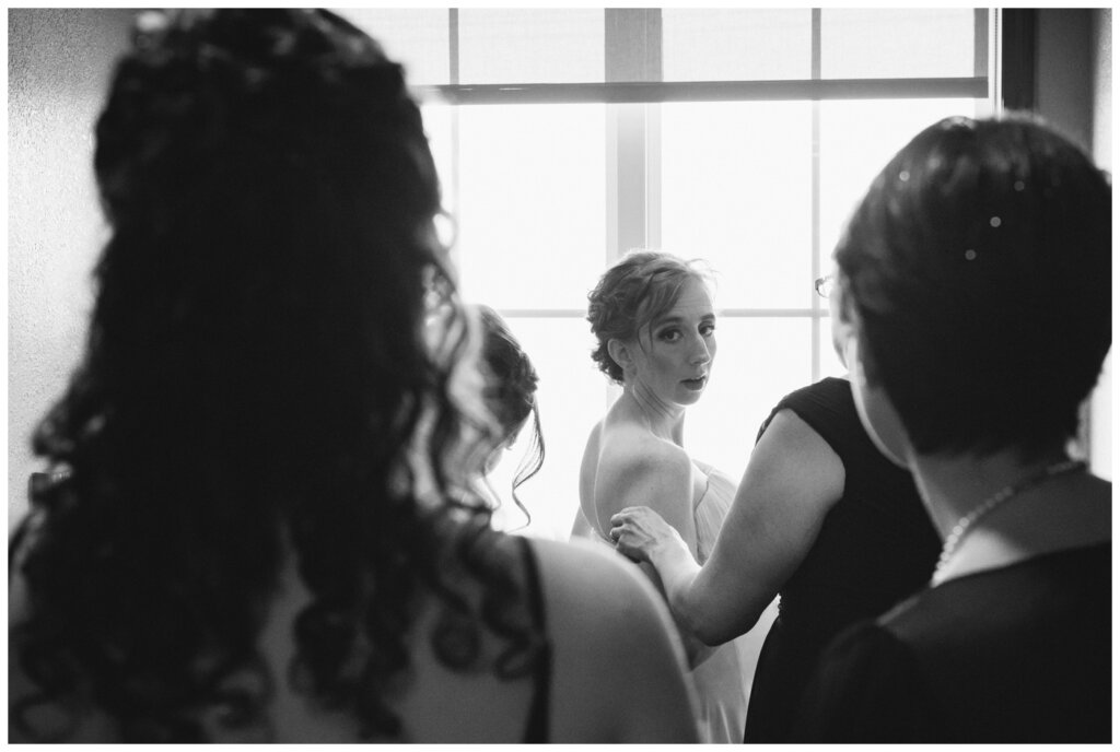 Shawn Jennifer - 04 - Moose Jaw Wedding Bridesmaids help bride into her gown
