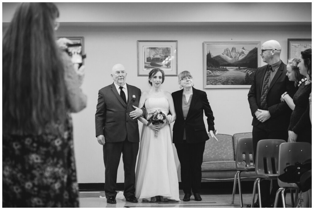 Shawn Jennifer - 17 - Moose Jaw Wedding Bride is escorted down the aisle by her parents