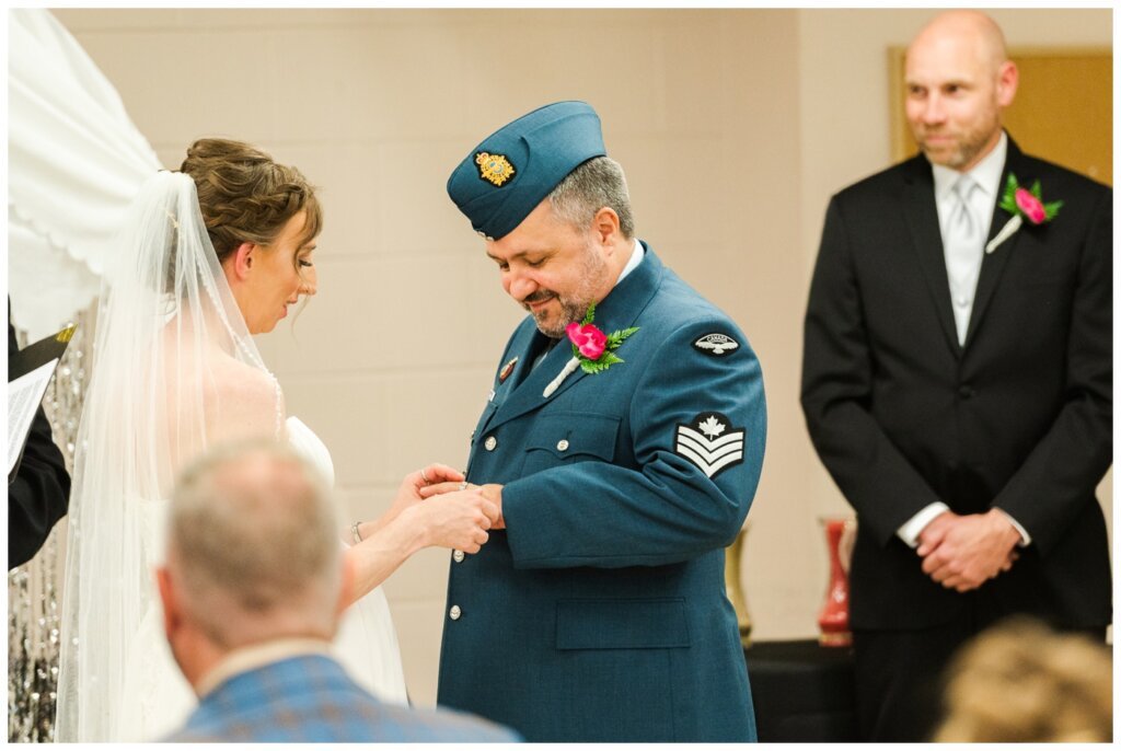 Shawn Jennifer - 19 - Moose Jaw Wedding Bride puts wedding band on her husbands finger