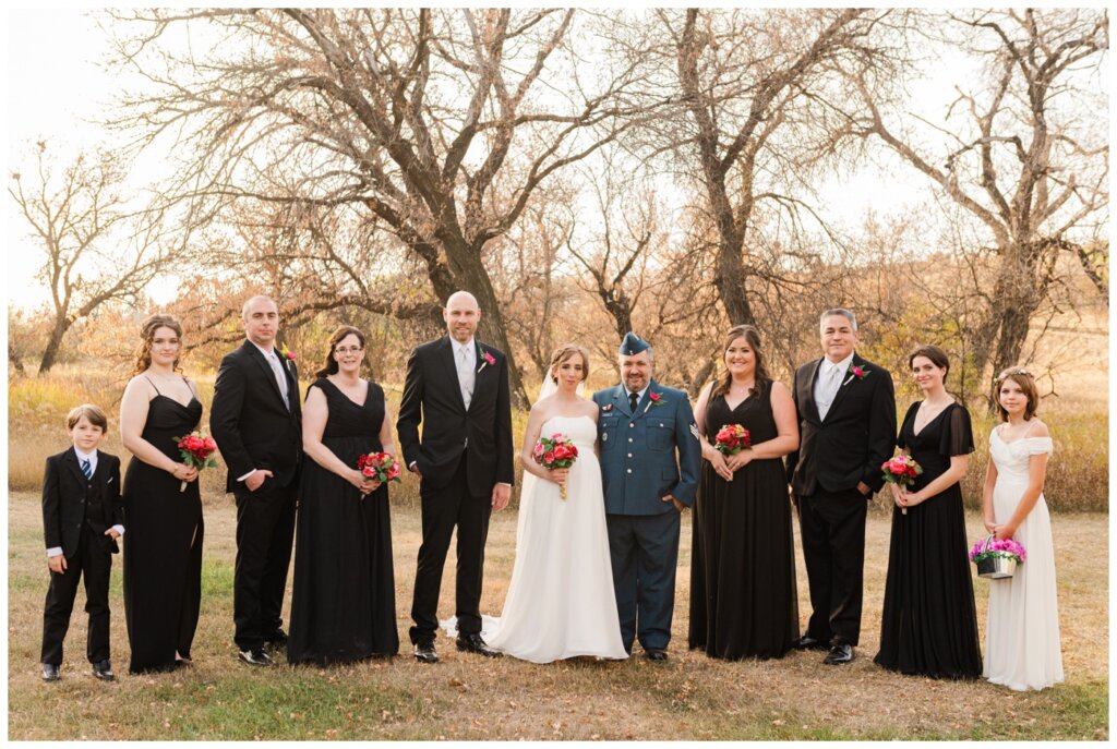 Shawn Jennifer - 21 - Moose Jaw Wedding Bride groom pose with bridal party in black suits and dresses