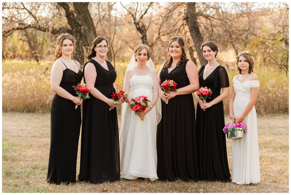 Shawn Jennifer - 23 - Moose Jaw Wedding Bride poses with her bridesmaids in their black and white dresses
