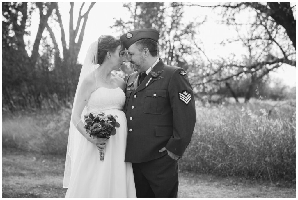 Shawn Jennifer - 24 - Moose Jaw Wedding Groom poses with his wife in his Canadian Air Force uniform