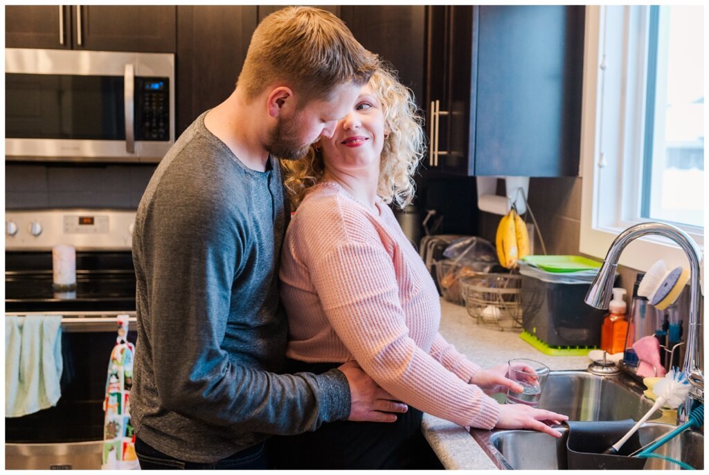 Tyrel & Allison - Winter 2022 - 04 - Couple standing at the kitchen sink