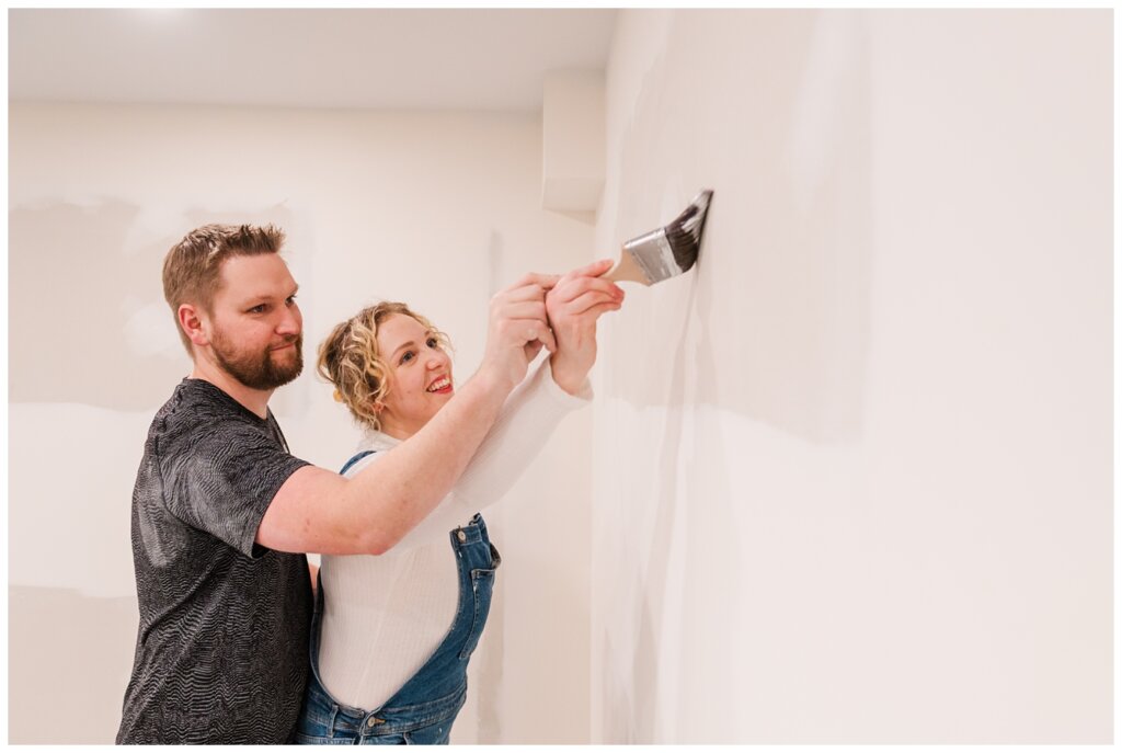 Tyrel & Allison - Winter 2022 - 10 - Husband and wife painting their basement walls together
