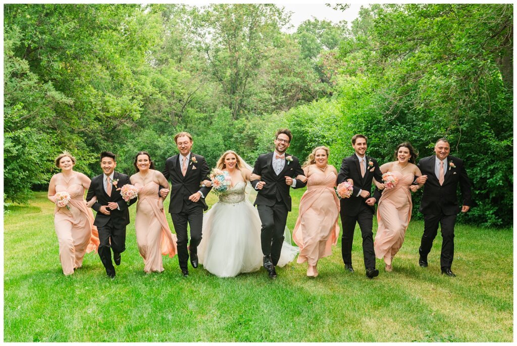 Brett & Rachelle - Delta Regina Wedding - 09 - Wedding Party skipping through Wascana Park