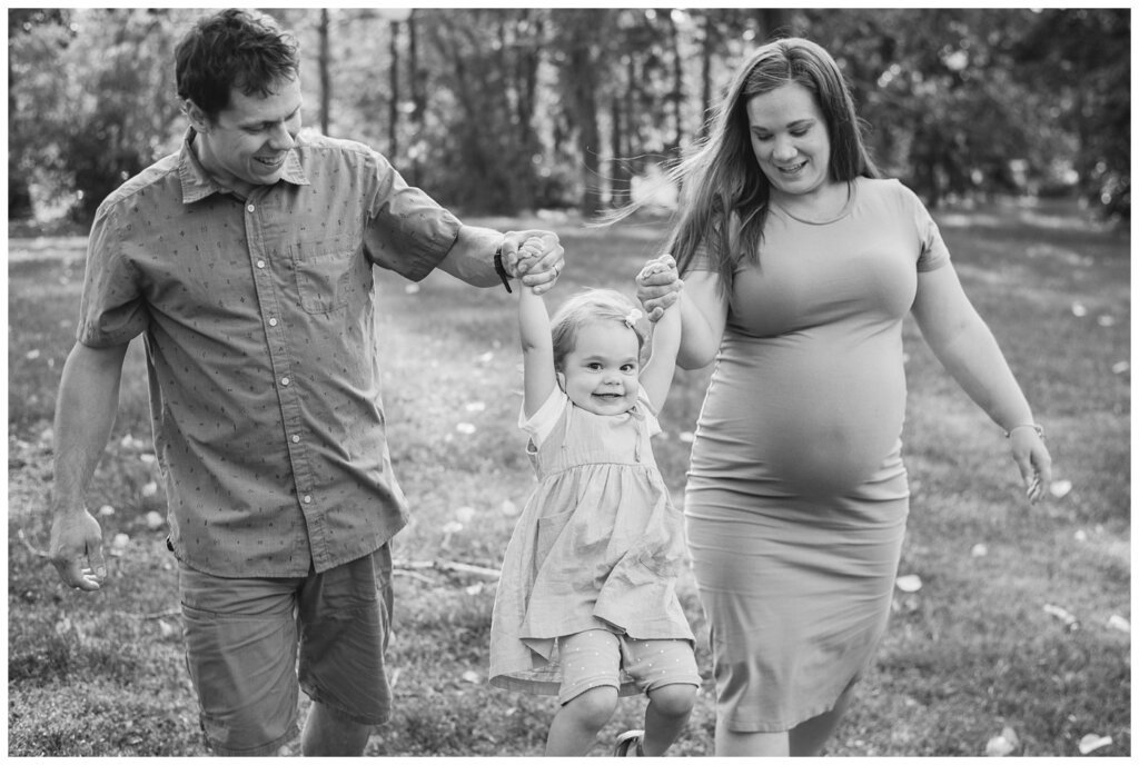 Filby Family 2023 - 06 - Little girl smiles at the camera as she swings