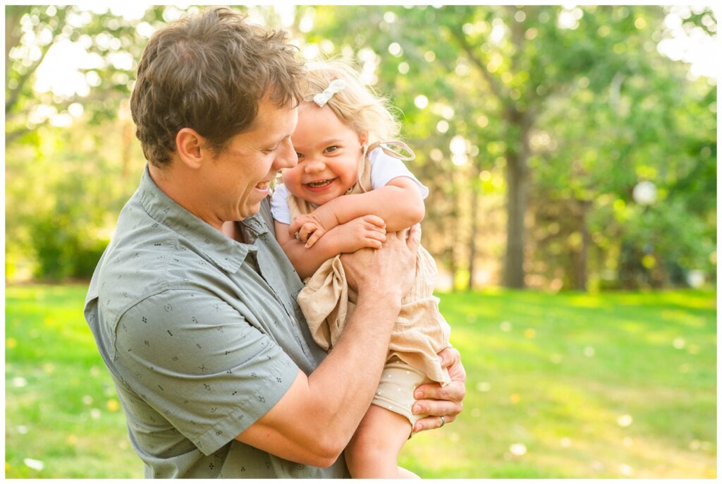 Filby Family 2023 - 08 - Little girl giggles as dad tickles her