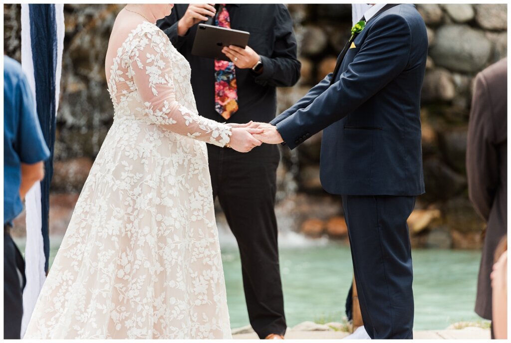 Jared & Haley - 13 - Couple holding hands during ceremony