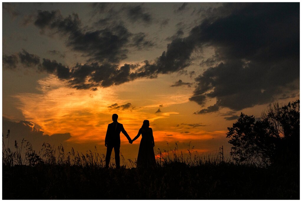 Ryan & Melissa - Hotel Sask Wedding - 26 - Silhouette of bride and groom at sunset in west Regina