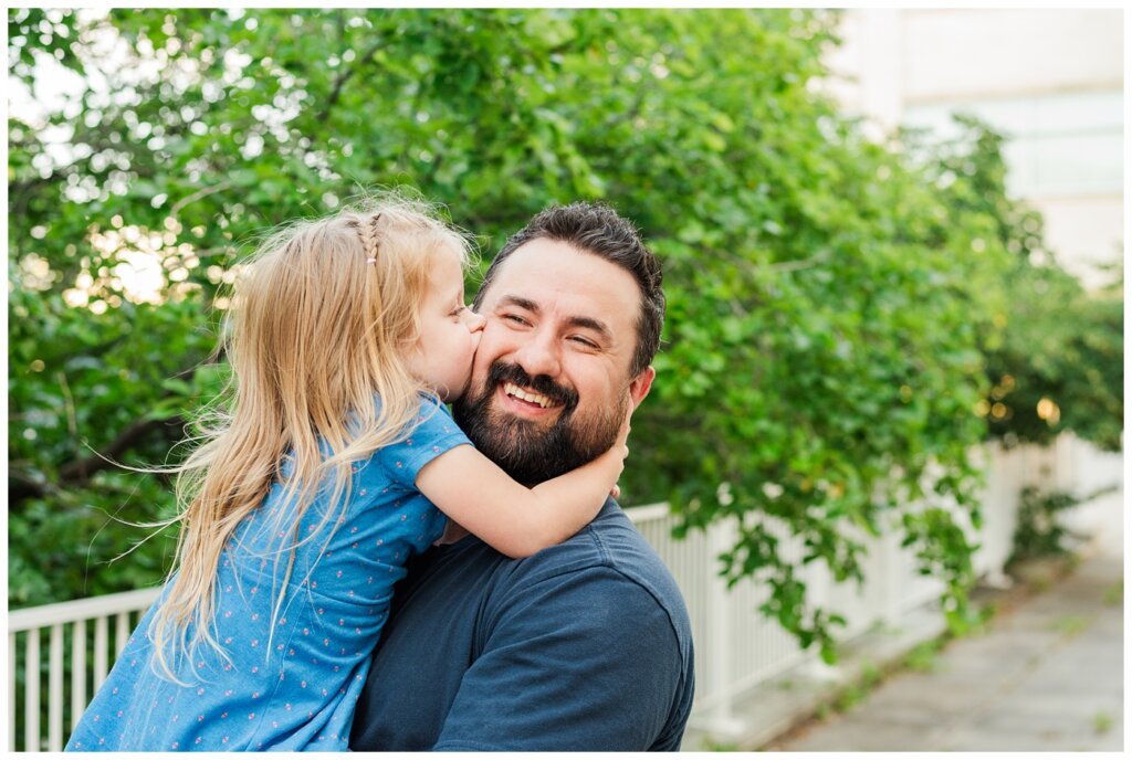 Eyre Family - University of Regina - 08 - Little girl gives her dad a big kiss on the cheek