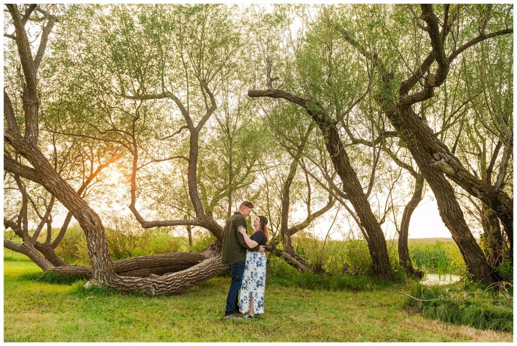 Kenny-Marrick-Engagement-Our-Lady-of-Lourdes-Shrine-01-Couple-dances-under-a-large-tree