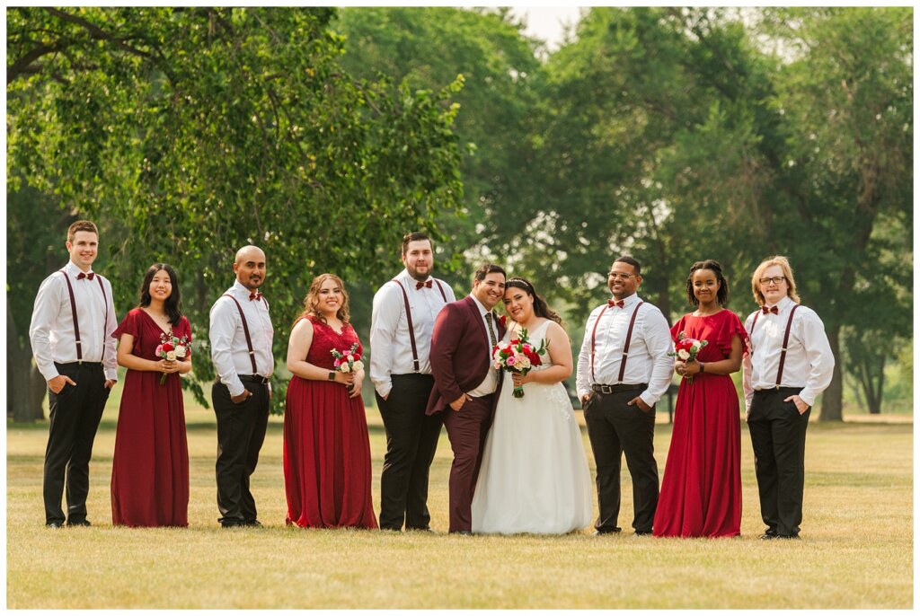 Luis & Keila - Summer wedding 2023 - Les Sherman Park - 11 - Bridal party with red and gold accents